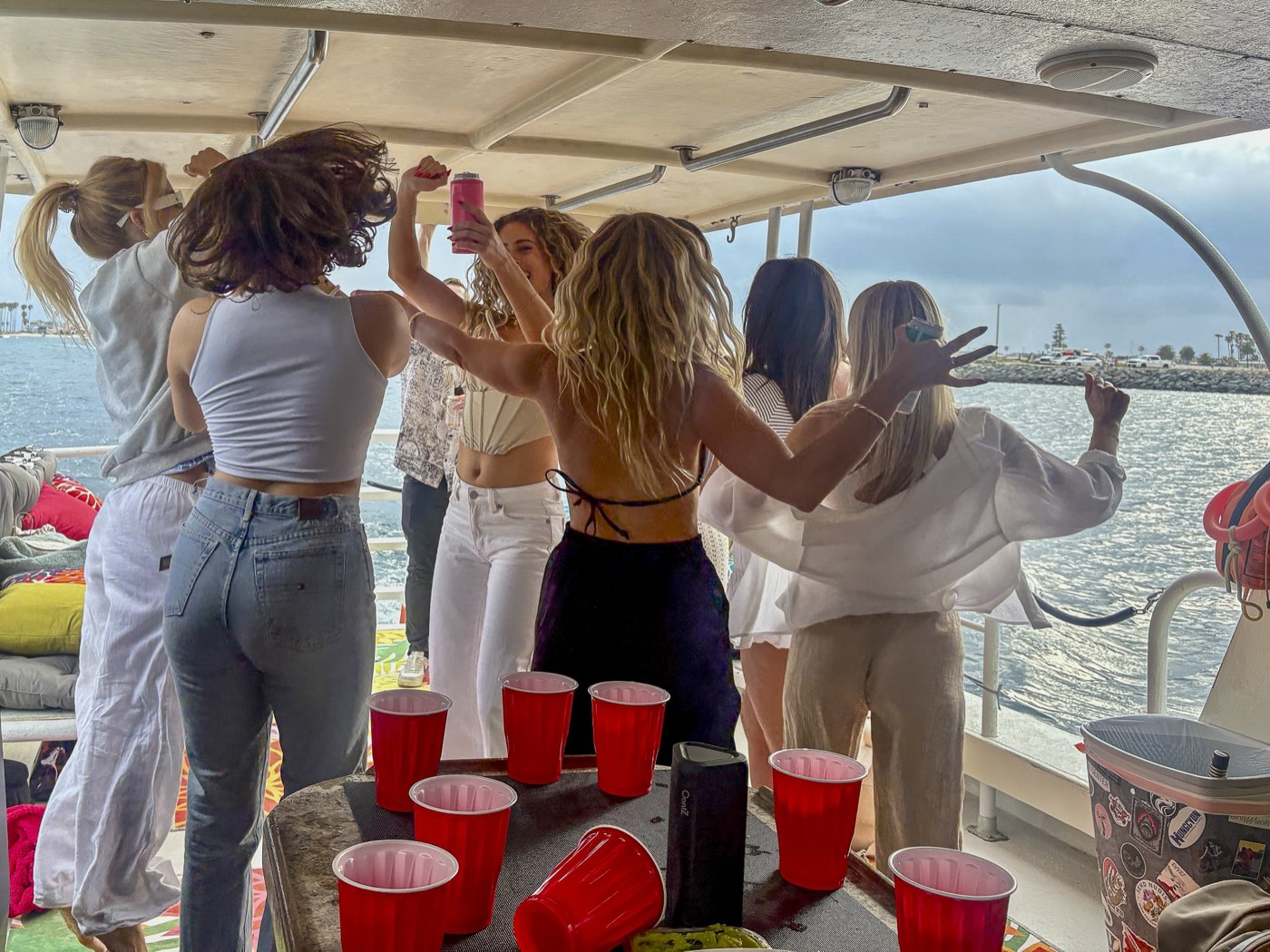 Guests dancing on the back deck of the Marissa on Mission Bay